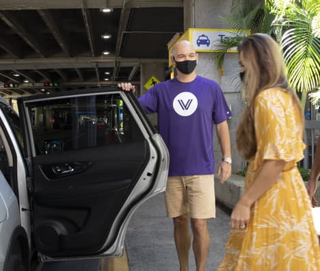 A Member awaits their GoVibe pickup at the airport 