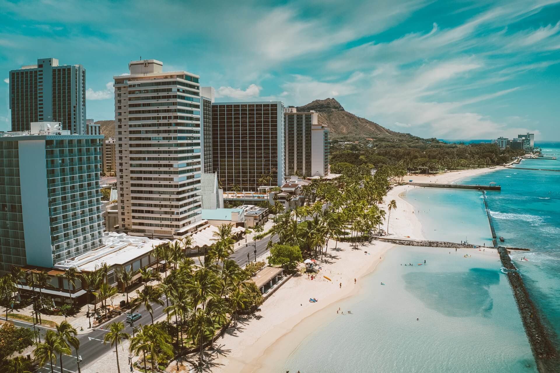 Aerial view of Honolulu high-rise buildings and coast