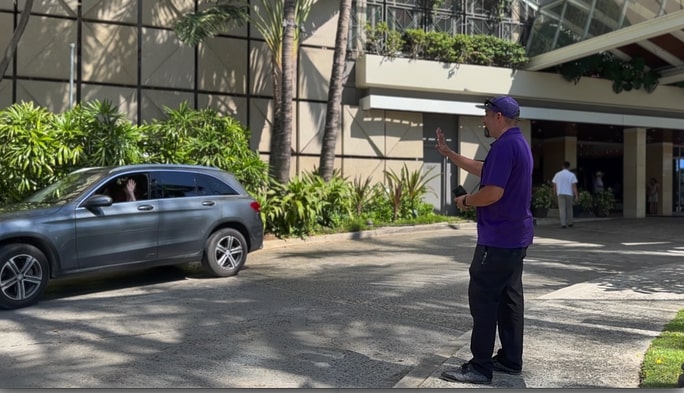 A GoVibe Member watching as her rental car arrives.