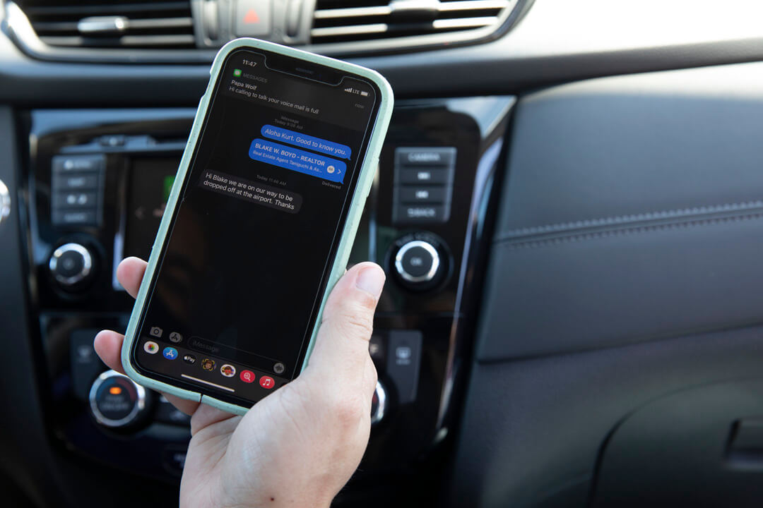 A close-up picture of a phone showing texts between a GoVibe Member and driver.